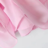 Robe cocktail rose poudré asymétrique